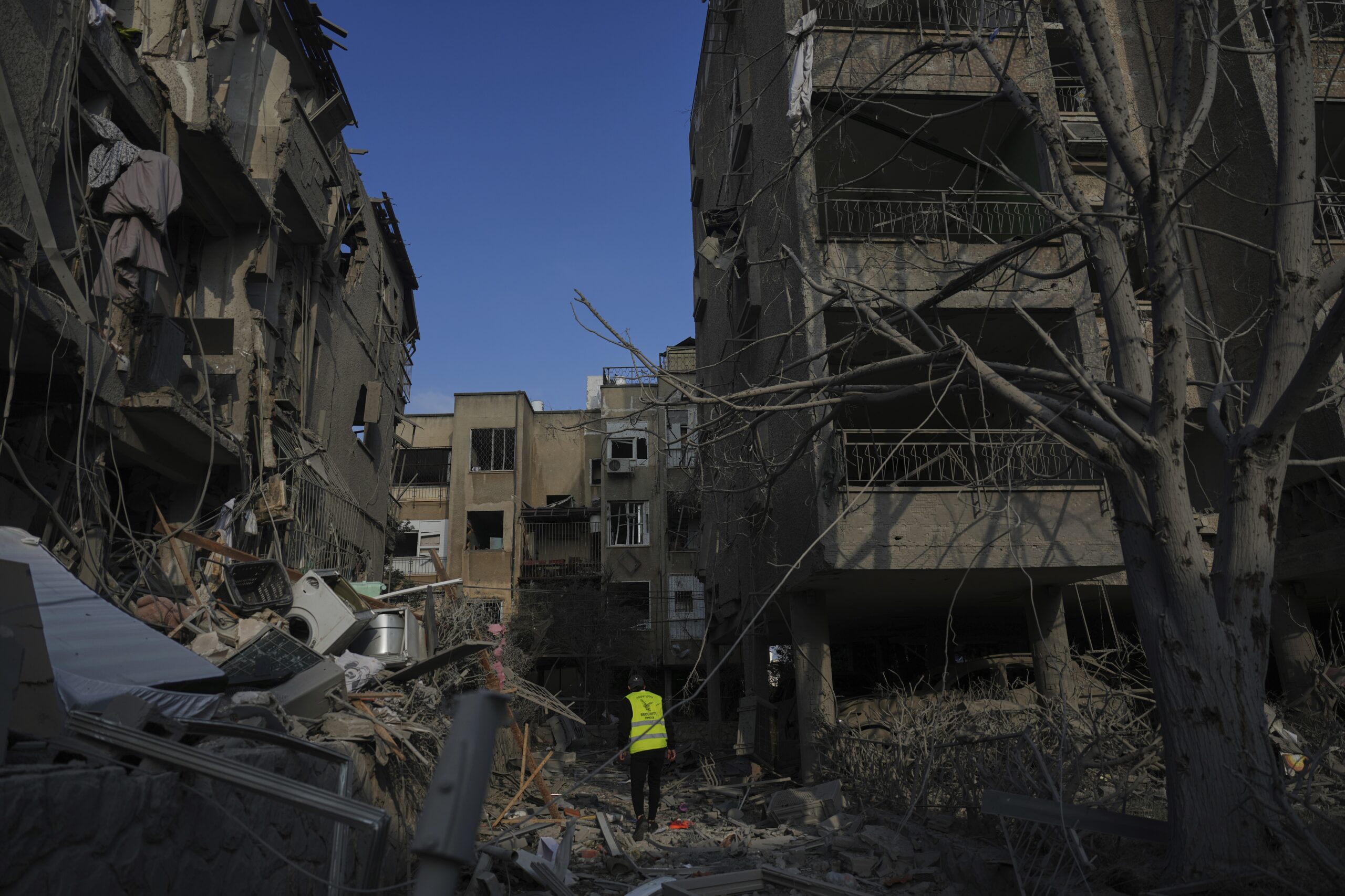 Israel says it killed 9 Iranian nuclear scientists, and braces for attacks from Iran